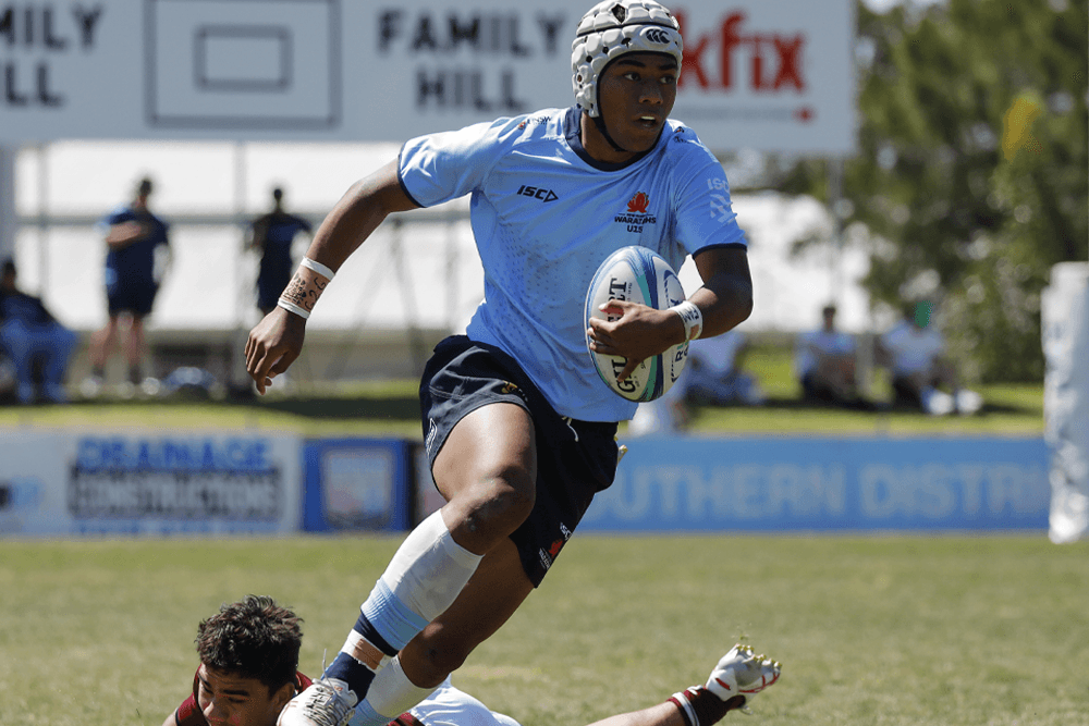 Jarryd King evades an attempted tackle.